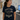 A woman in a hospital or clinic setting wearing a navy blue graphic t-shirt that reads 'BLACK CLOUD SOCIAL CLUB' with a cloud graphic wearing sunglasses, paired with navy scrub pants.