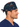 Front view of a man wearing a navy Code Noel Christmas scrub cap with medical holiday print