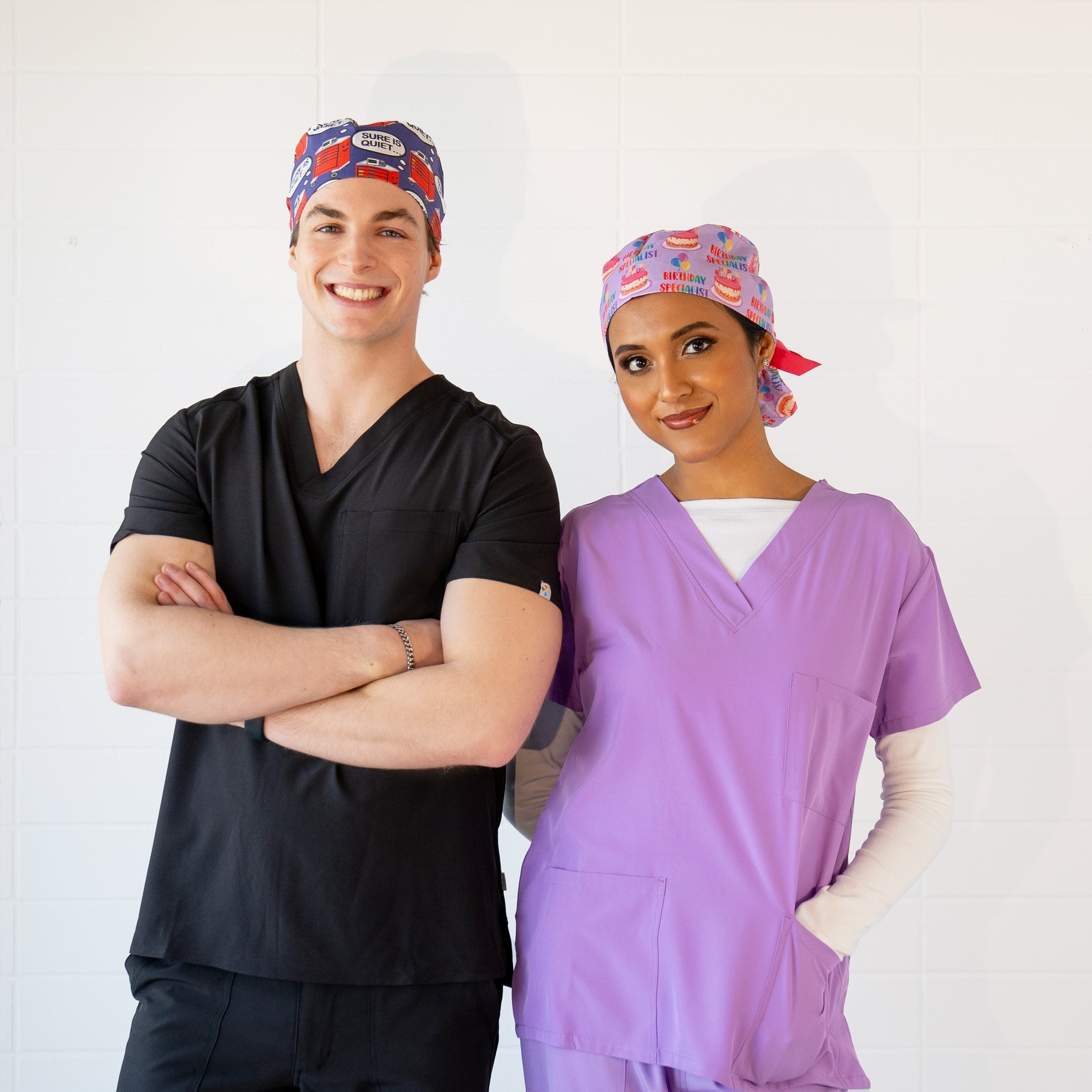 Nurses wearing scrubs and handmade scrub caps by Louis and Phil.