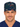 Front view of a man wearing a navy Code Noel Christmas scrub cap with medical holiday print